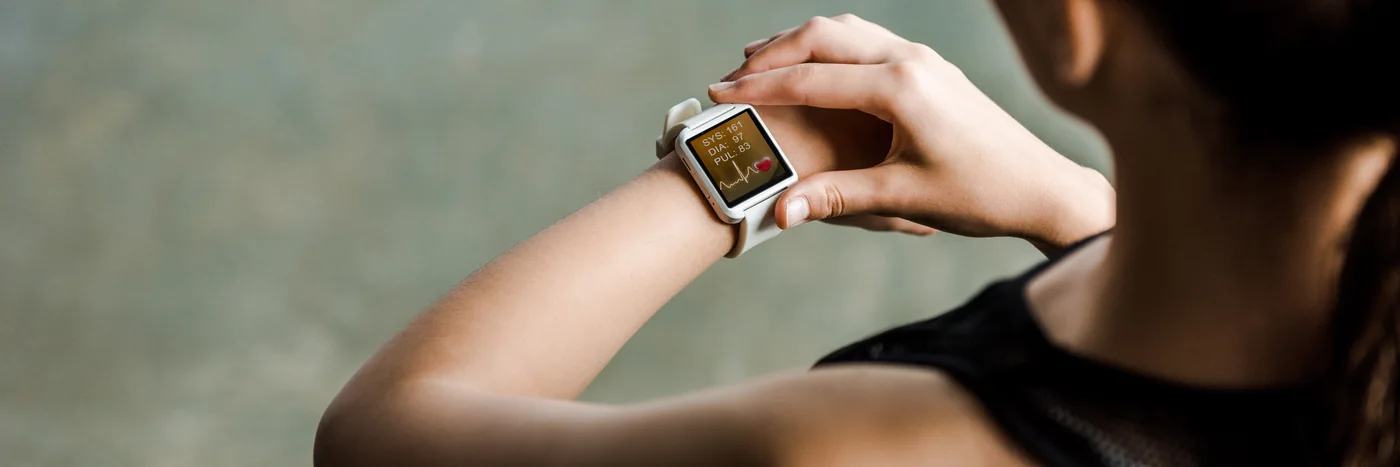 A person checking a heart-rate reading on a smartwatch.